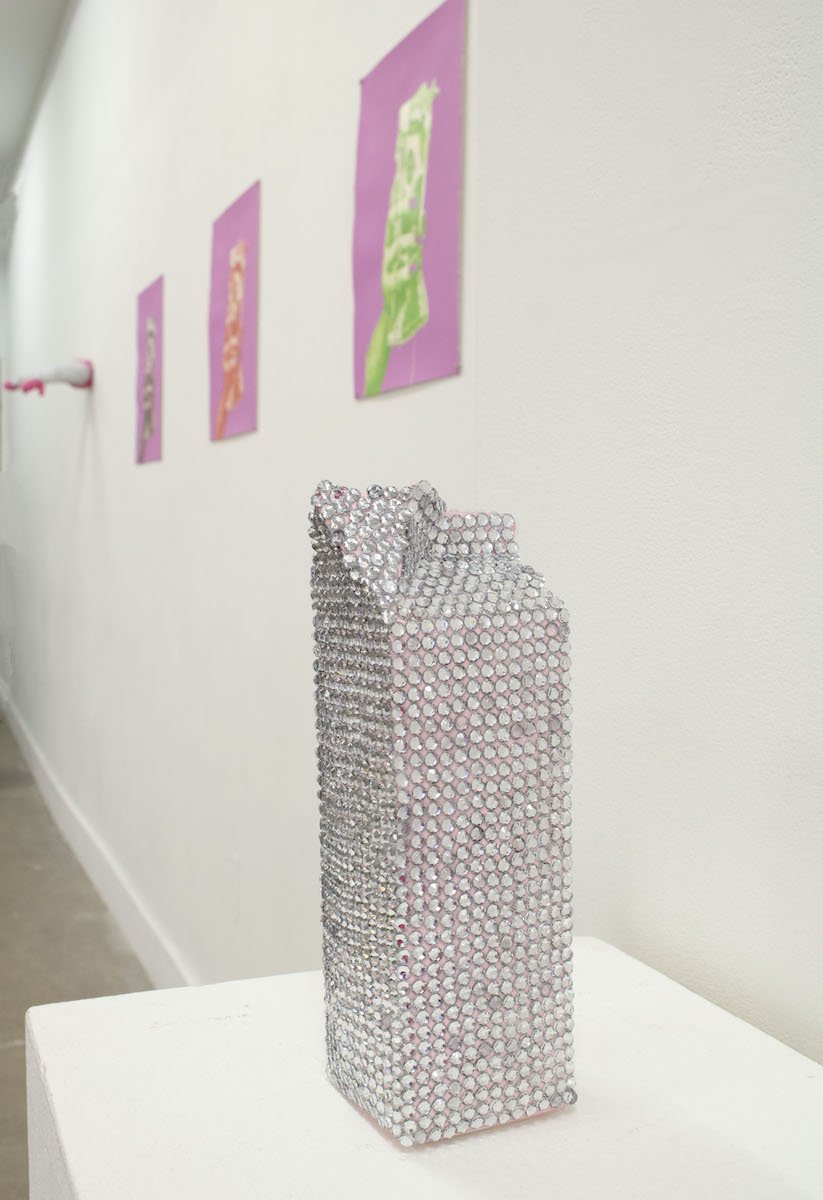 A milk carton that is entirely bedazzled