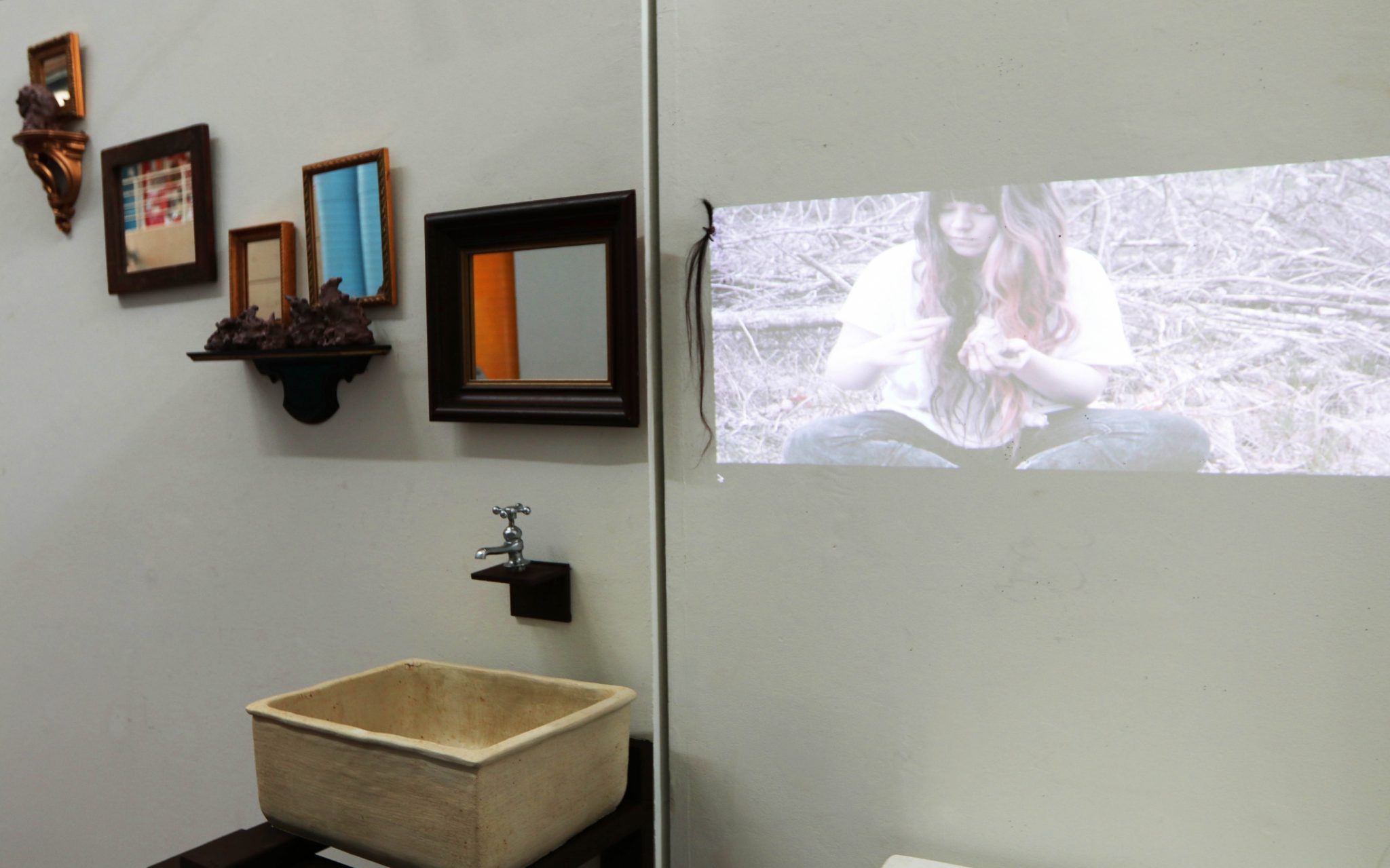 A photo of art from "Age Ingrained" showing an old bathroom vanity