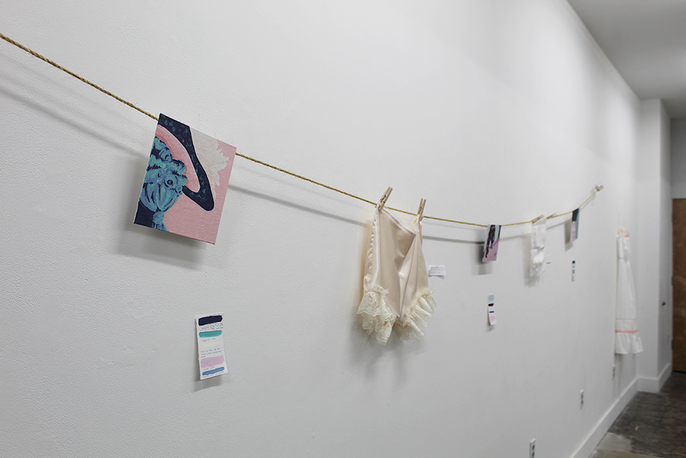 A photo of artifacts from the gallery display hanging from a clothesline