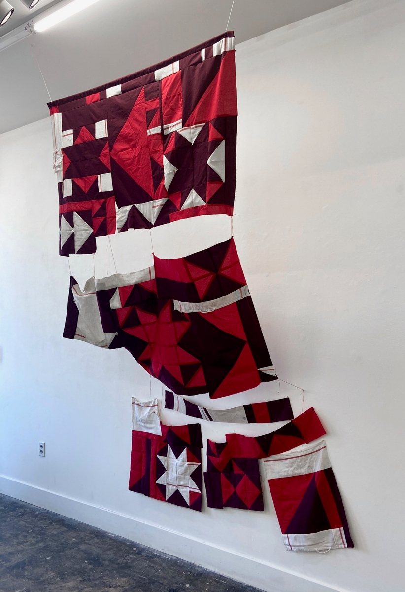 Quilt pieces of black, red, and white