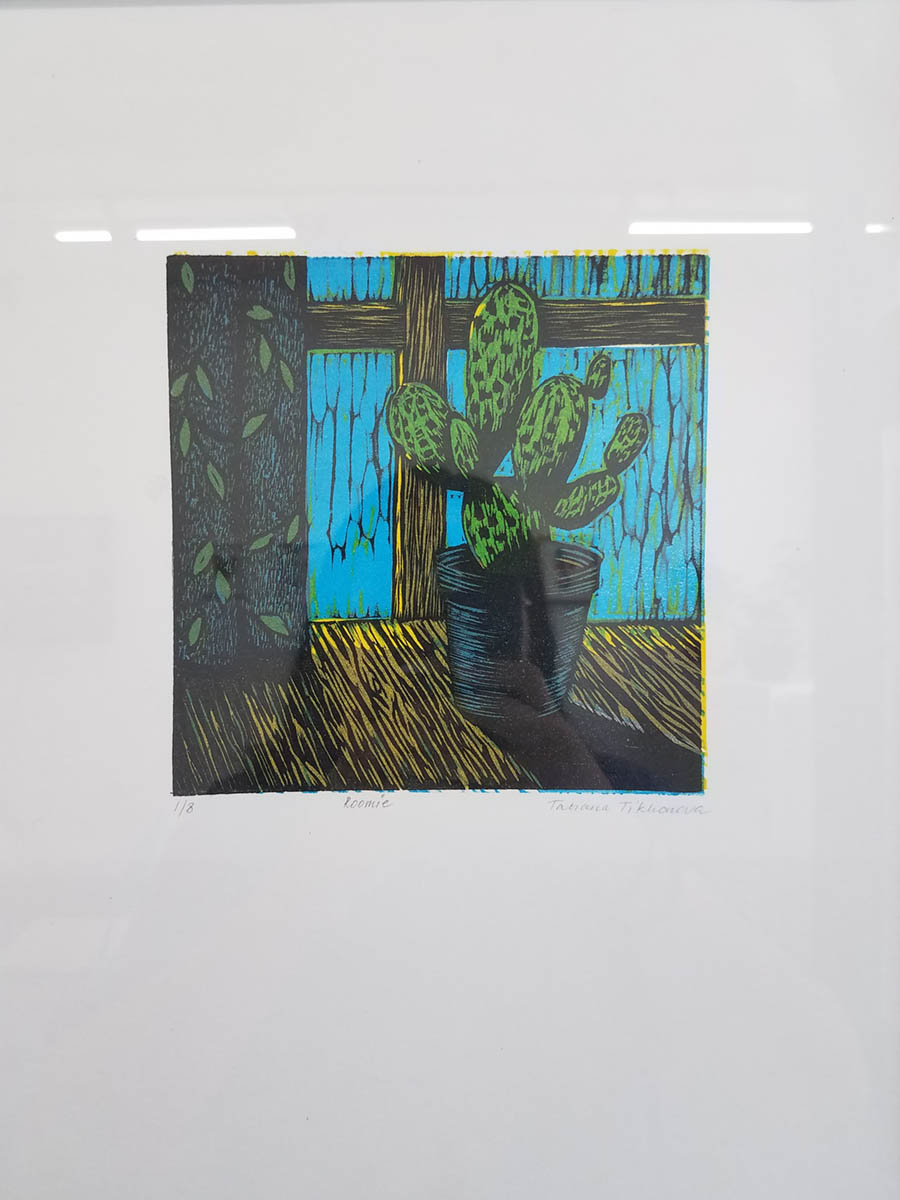 A printwork of a cactus in a windowsill as part of the Domestic Oasis installation