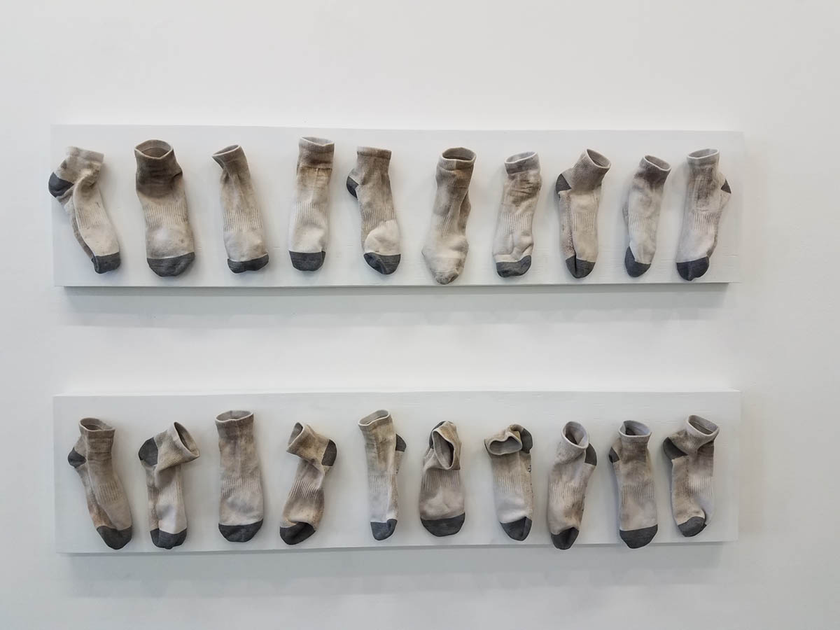 Dirty socks pinned to the wall