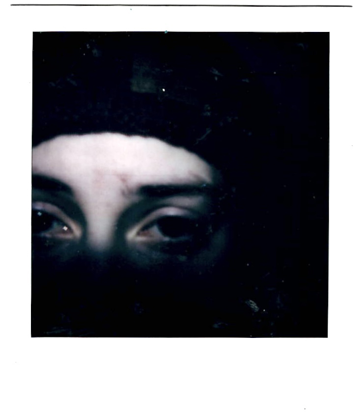 A close up photo of a person's eyes with a depressed expression