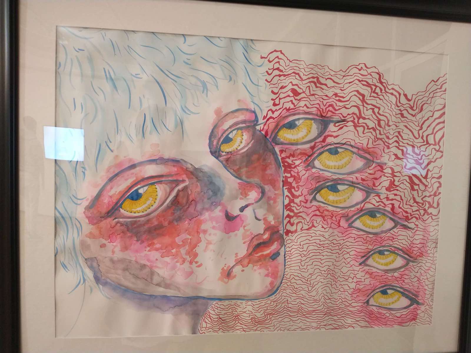 An artwork showing a womans face with freestanding eyes next to her
