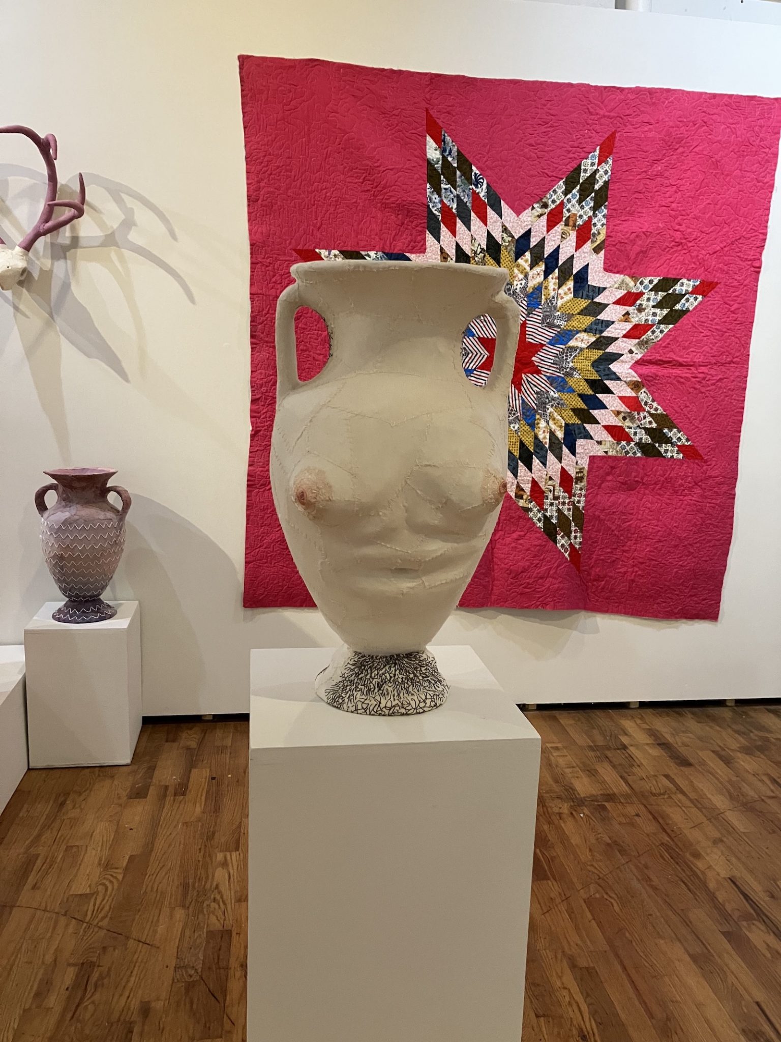 A collection of MFA artworks, mostly sculptures, in the gallery