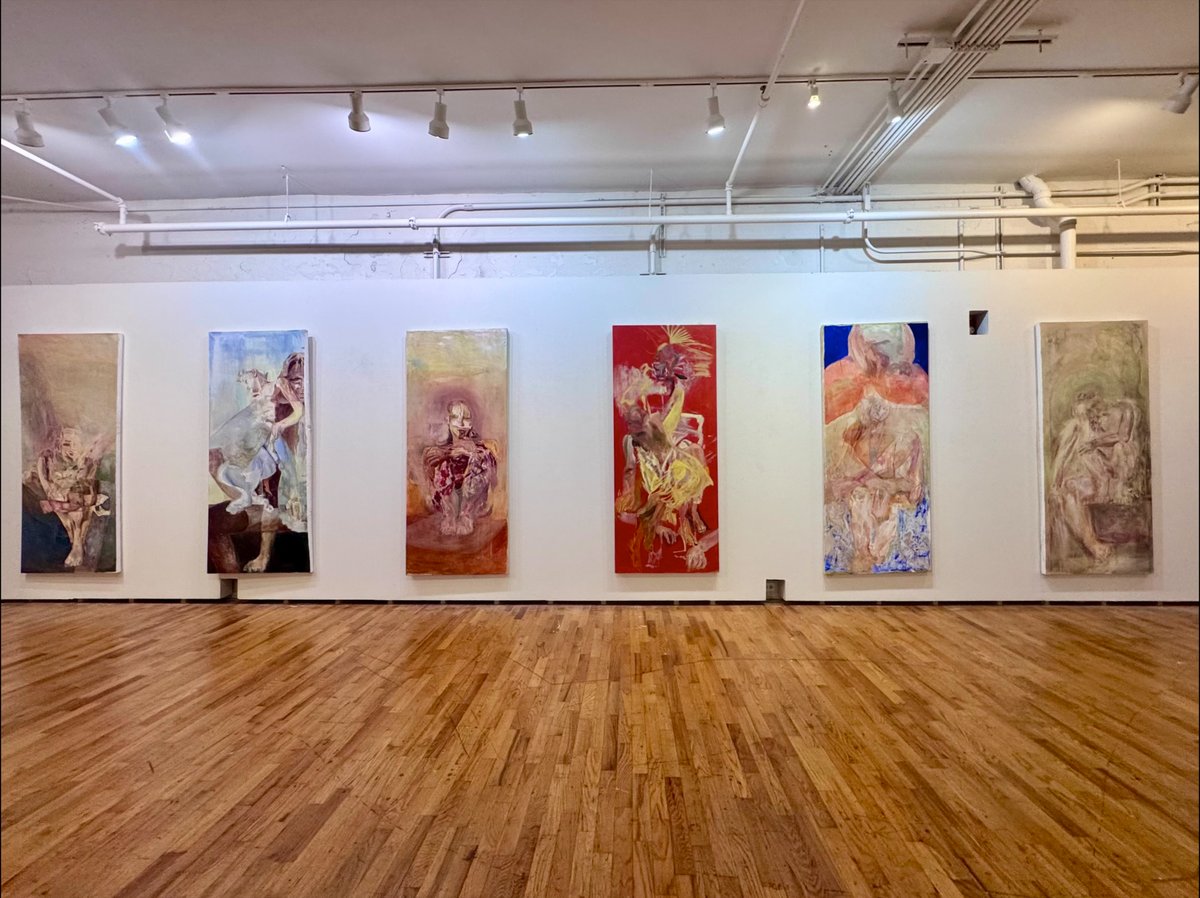 Gallery with six large vertical paintings.