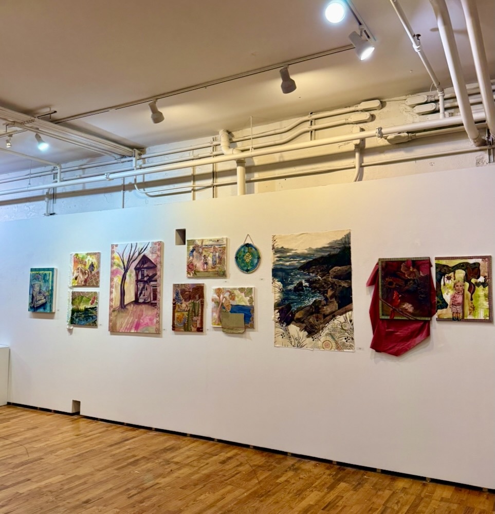 Gallery wall with salon style paintings of exterior and interior scenes.